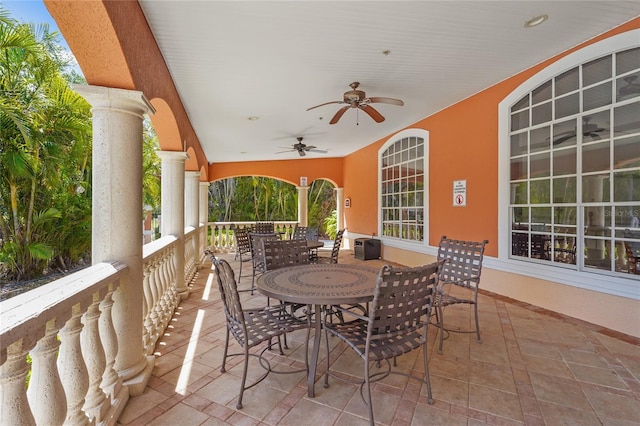 view of patio featuring outdoor dining space and a ceiling fan