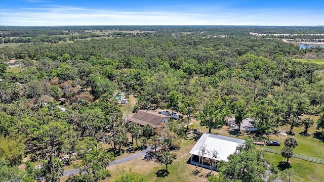 bird's eye view featuring a wooded view