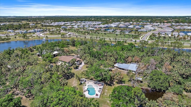 bird's eye view featuring a water view and a residential view