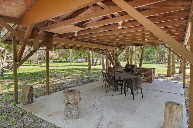 view of patio / terrace with outdoor dining space and a grill