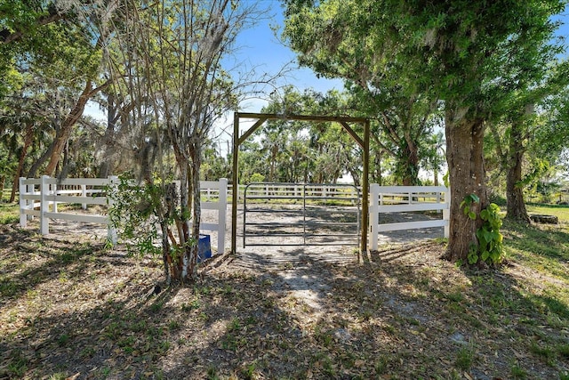 view of gate featuring fence