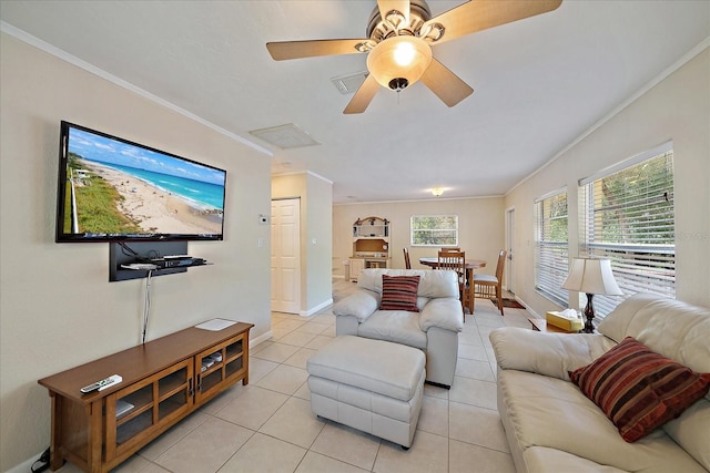 living area with crown molding, light tile patterned flooring, a ceiling fan, and visible vents