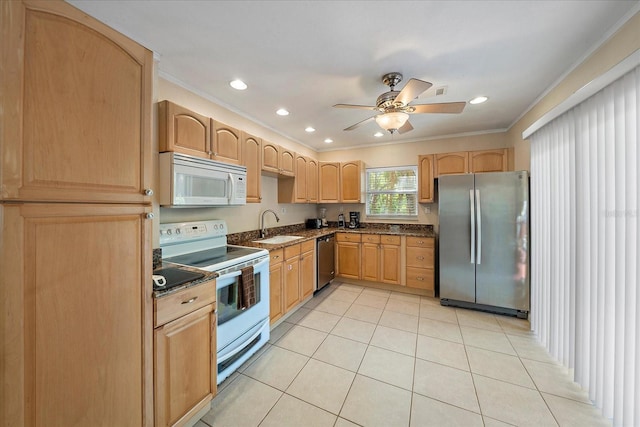kitchen with appliances with stainless steel finishes, light tile patterned floors, ceiling fan, a sink, and light brown cabinetry