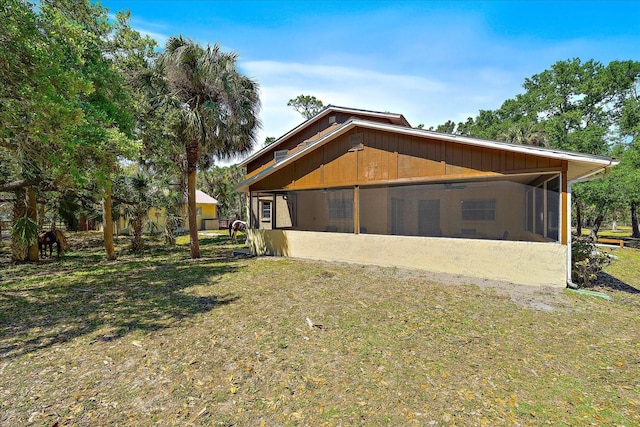 view of home's exterior featuring a sunroom