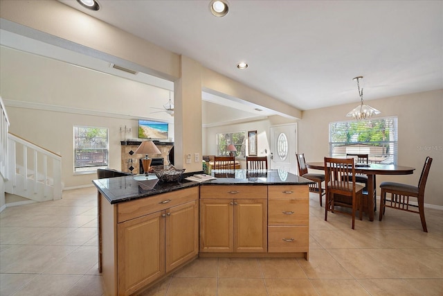 kitchen with recessed lighting, light tile patterned floors, visible vents, dark stone counters, and pendant lighting