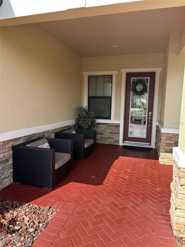 4622 Grand Lakeside Dr, Palm Harbor, FL 34684 - property entrance with stone siding and stucco siding