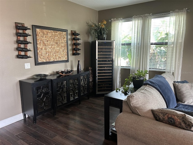 4622 Grand Lakeside Dr, Palm Harbor, FL 34684 - living area featuring dark wood-style floors and baseboards