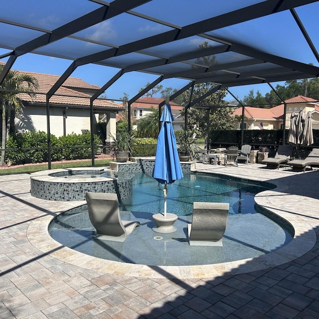 4622 Grand Lakeside Dr, Palm Harbor, FL 34684 - view of pool featuring a pool with connected hot tub, a patio, and glass enclosure