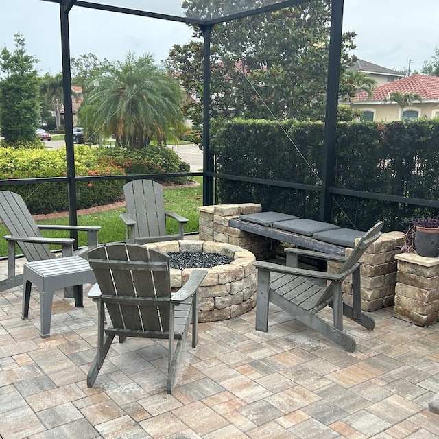 4622 Grand Lakeside Dr, Palm Harbor, FL 34684 - view of patio with a fire pit and a lanai