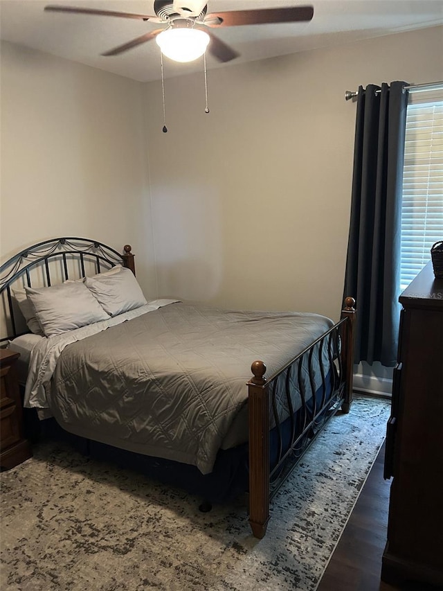 4622 Grand Lakeside Dr, Palm Harbor, FL 34684 - bedroom with ceiling fan and wood finished floors