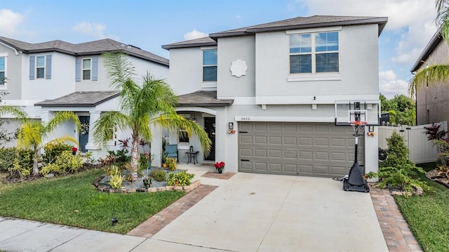 5426 Rainwood Meadows Dr, Apollo Beach, FL 33572 - view of front of property featuring stucco siding, driveway, an attached garage, a front lawn, and fence