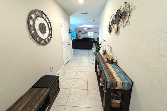 5426 Rainwood Meadows Dr, Apollo Beach, FL 33572 - hallway featuring light tile patterned floors and visible vents