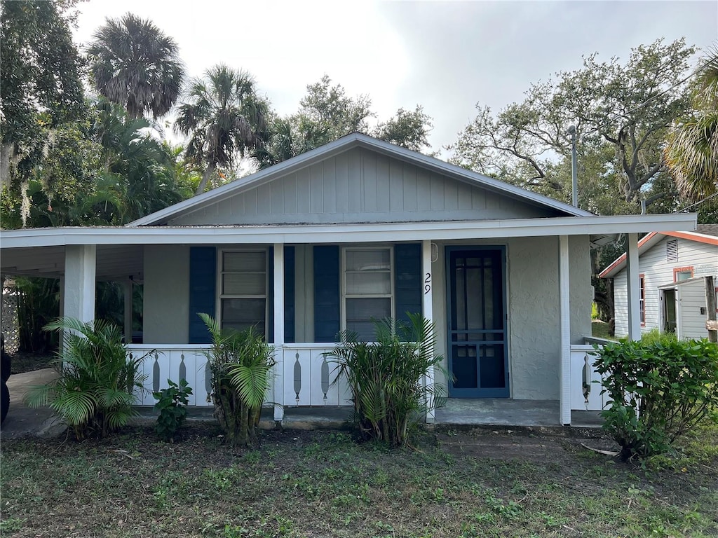 29 Michiana Dr, Terra Ceia, FL 34250 - bungalow-style house with covered porch and stucco siding
