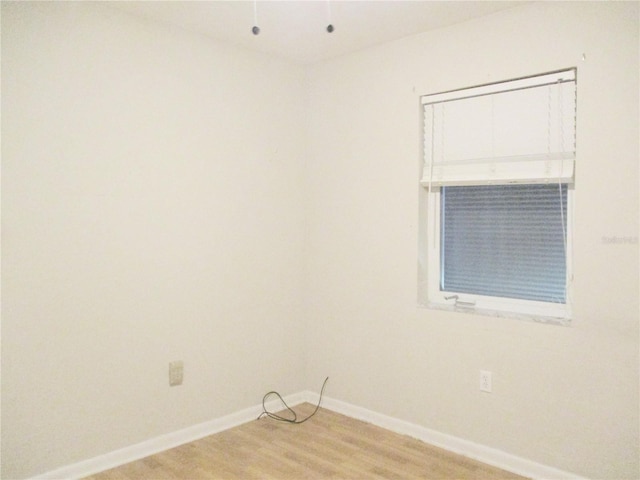 6339 Pontiac Ln, North Port, FL 34287 - empty room featuring baseboards and light wood-style floors