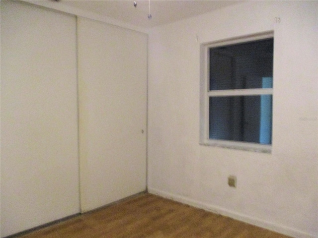 6339 Pontiac Ln, North Port, FL 34287 - empty room with wood finished floors and baseboards