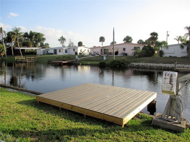 6339 Pontiac Ln, North Port, FL 34287 - dock with a water view and a lawn
