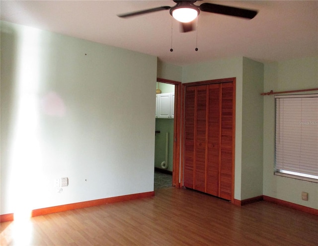 6339 Pontiac Ln, North Port, FL 34287 - unfurnished bedroom featuring a closet, wood finished floors, and ceiling fan