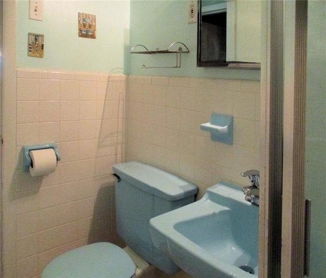 6339 Pontiac Ln, North Port, FL 34287 - half bathroom featuring tile walls and wainscoting