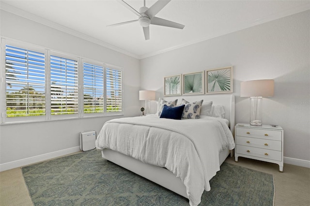 bedroom featuring ceiling fan, baseboards, ornamental molding, and carpet floors