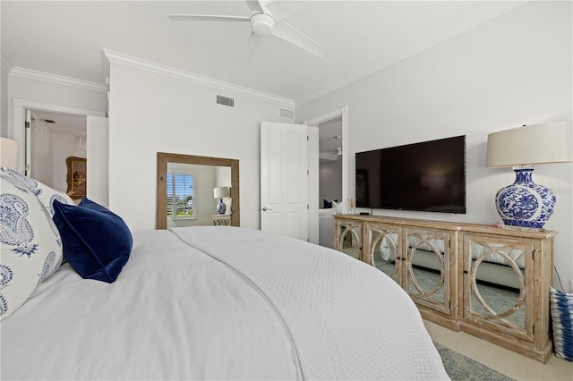 carpeted bedroom featuring visible vents, crown molding, and ceiling fan