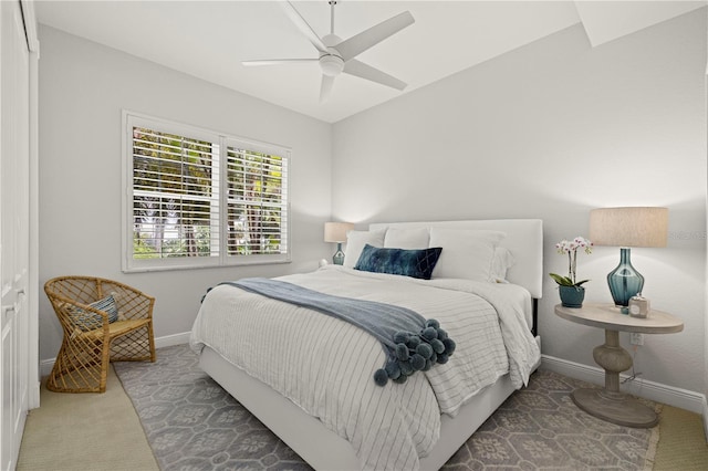 carpeted bedroom with baseboards and ceiling fan