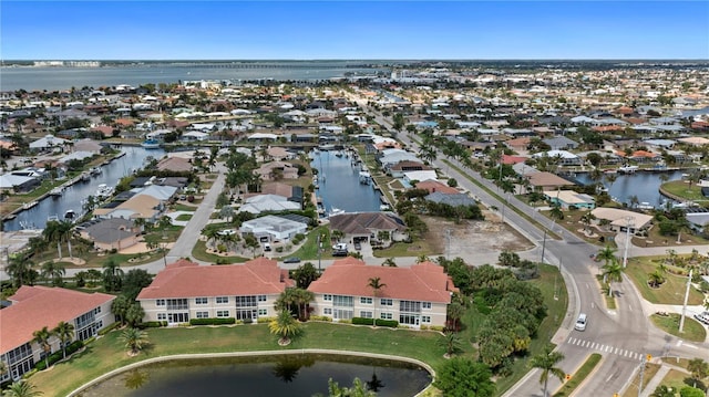 bird's eye view with a residential view and a water view