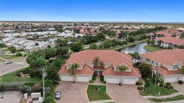aerial view featuring a residential view and a water view