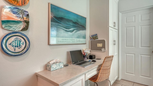 office space with light tile patterned flooring