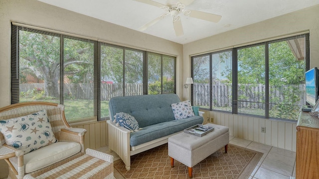 sunroom / solarium with ceiling fan, a wealth of natural light, and an outdoor hangout area