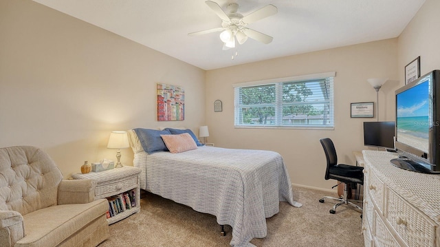 bedroom featuring baseboards, a ceiling fan, and light colored carpet