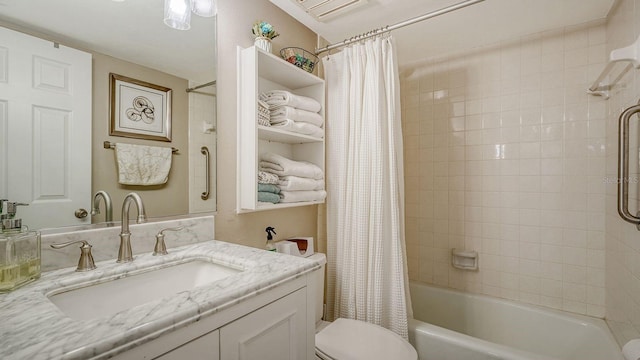 bathroom with vanity, shower / bath combination with curtain, and toilet