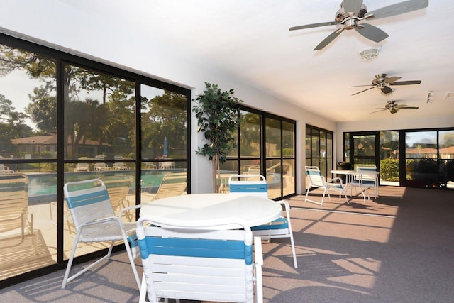 sunroom with visible vents and a ceiling fan