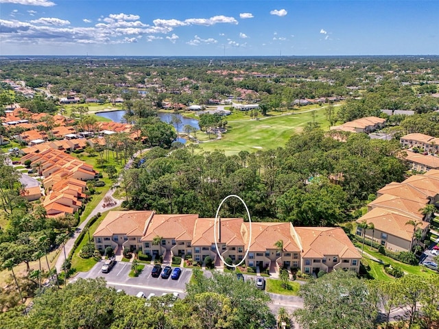 birds eye view of property with a water view, golf course view, and a residential view