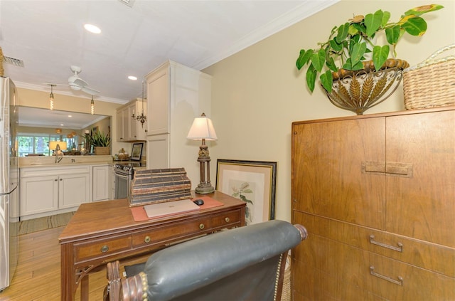 office featuring ornamental molding, recessed lighting, light wood-style floors, visible vents, and a sink