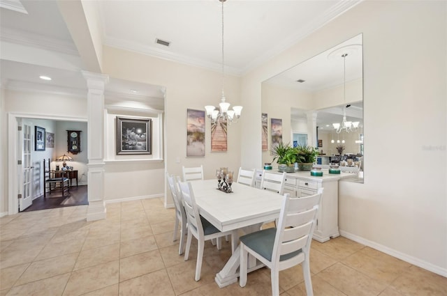 dining area with a chandelier, decorative columns, visible vents, and light tile patterned floors