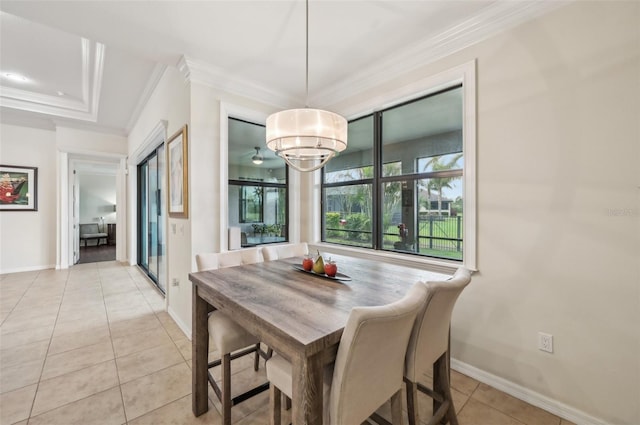 dining space featuring light tile patterned floors, baseboards, ornamental molding, and an inviting chandelier