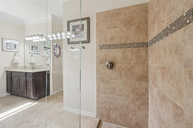 full bathroom featuring vanity, baseboards, ornamental molding, tile patterned floors, and walk in shower