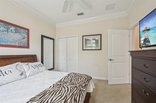 bedroom featuring light carpet, multiple closets, visible vents, and crown molding