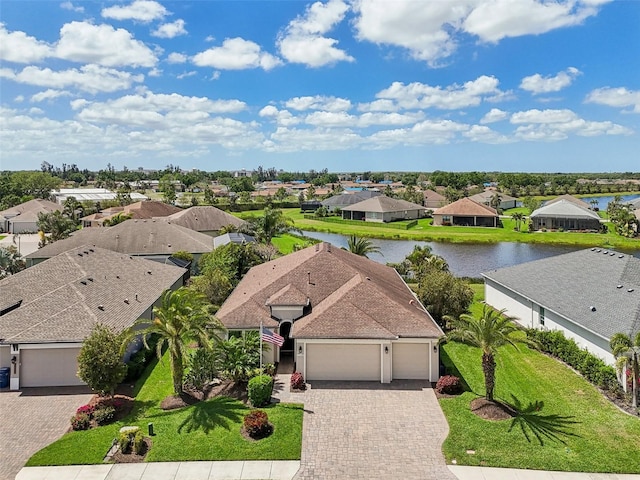 bird's eye view with a residential view and a water view
