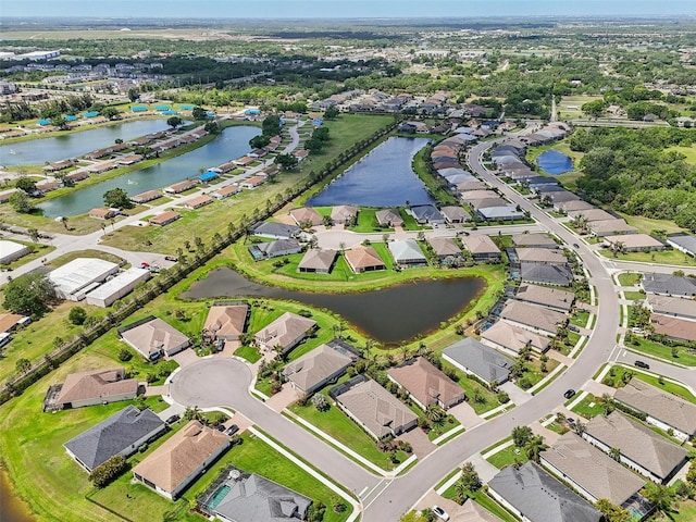 bird's eye view with a water view and a residential view