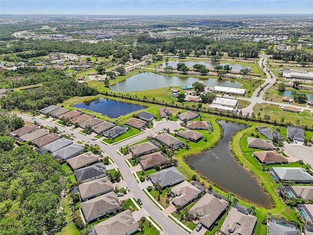 aerial view featuring a residential view and a water view