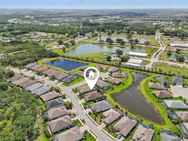 aerial view with a water view and a residential view
