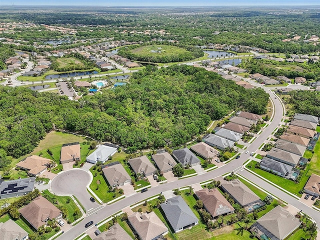 aerial view featuring a water view and a residential view