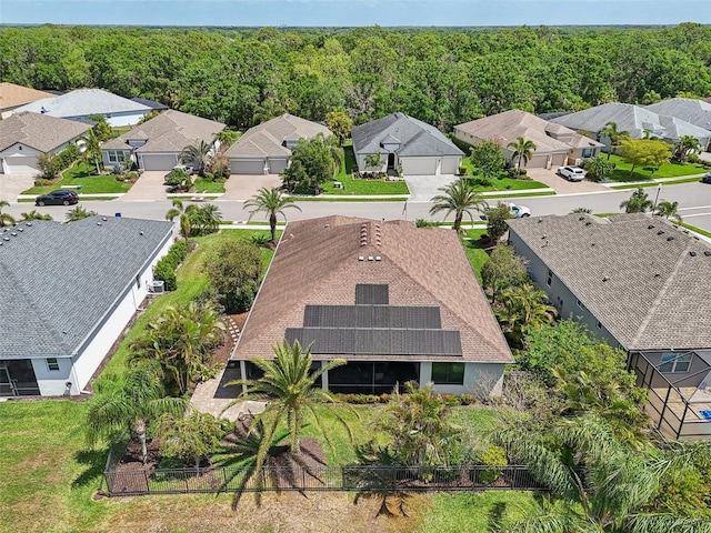 bird's eye view featuring a forest view and a residential view