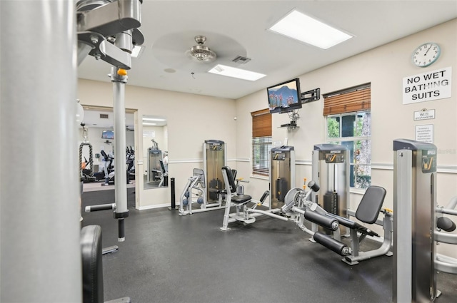 gym featuring baseboards and visible vents