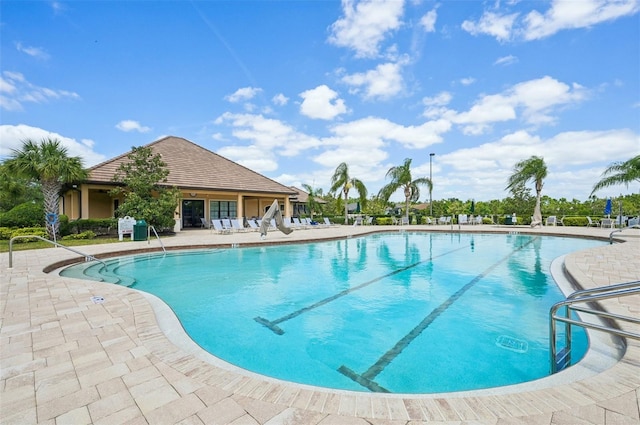 community pool featuring a patio area