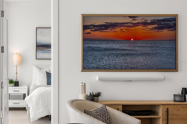 301 Quay Commons Unit 507, Sarasota, FL 34236 - bedroom featuring a water view and wood finished floors