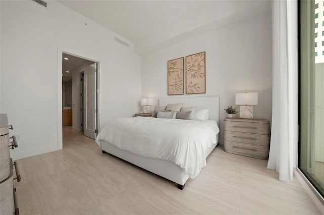 301 Quay Commons Unit 507, Sarasota, FL 34236 - bedroom featuring connected bathroom