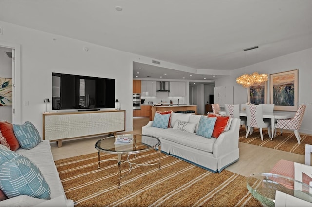 301 Quay Commons Unit 1610, Sarasota, FL 34236 - living room featuring a chandelier