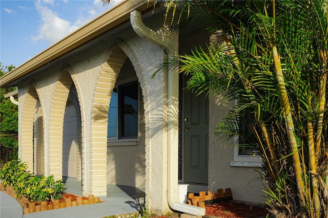 view of side of property with stucco siding